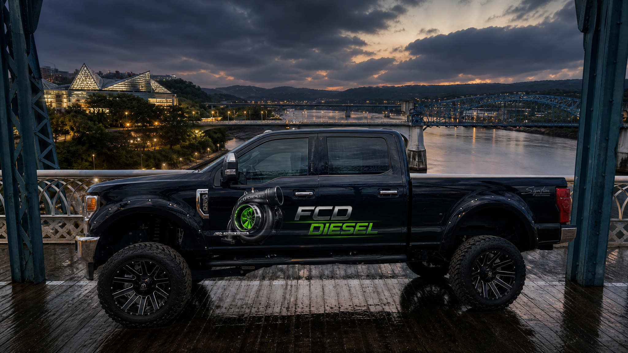 Diesel truck on Market Street Bridge in Chattanooga, Tennessee with Tennessee Aquarium skyline